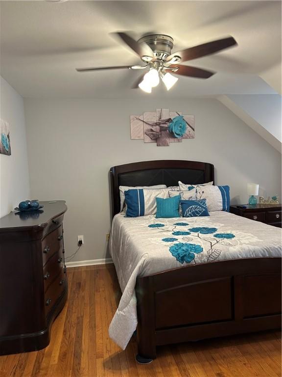 38 Hemlock Ln, Erwin, NY 14870 - bedroom featuring wood finished floors, a ceiling fan, and vaulted ceiling