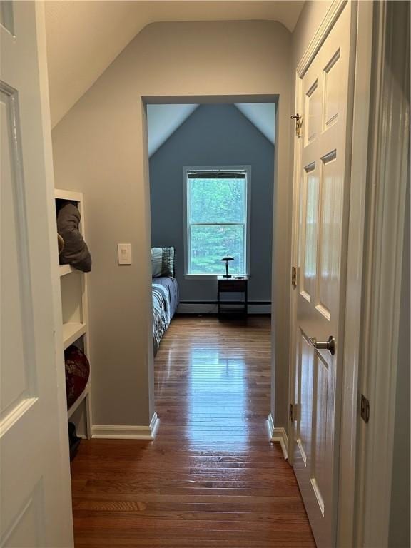 38 Hemlock Ln, Erwin, NY 14870 - corridor featuring vaulted ceiling, a baseboard heating unit, and dark wood finished floors