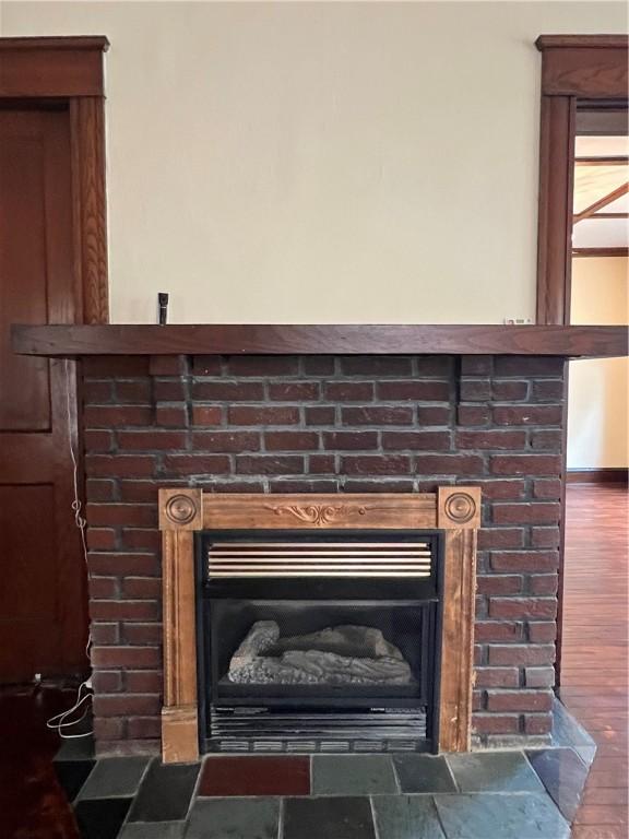 534 Mount Zoar St, Elmira-City, NY 14904 - detailed view of a fireplace and wood finished floors