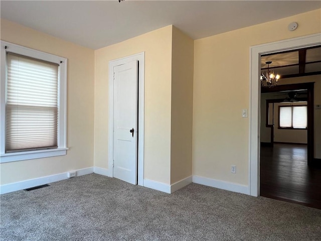 534 Mount Zoar St, Elmira-City, NY 14904 - unfurnished bedroom with carpet flooring and a chandelier