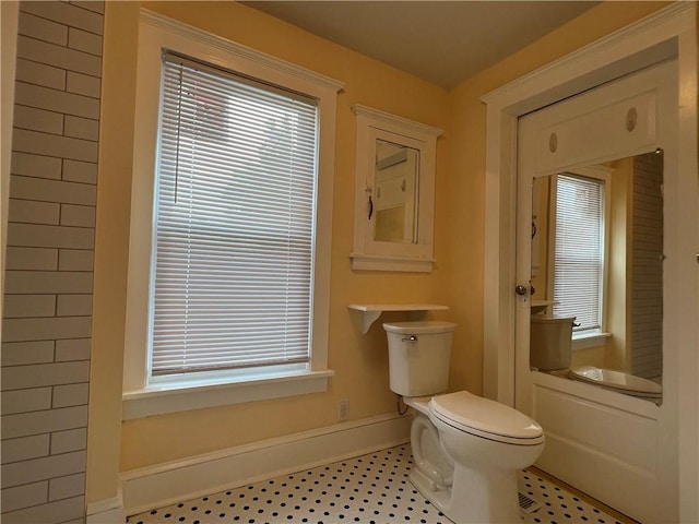 534 Mount Zoar St, Elmira-City, NY 14904 - bathroom featuring toilet and baseboards