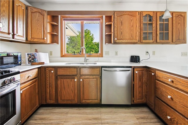 9 Jacob Dr, Erwin, NY 14870 - kitchen with stainless steel appliances, open shelves, brown cabinetry, light countertops, and glass insert cabinets