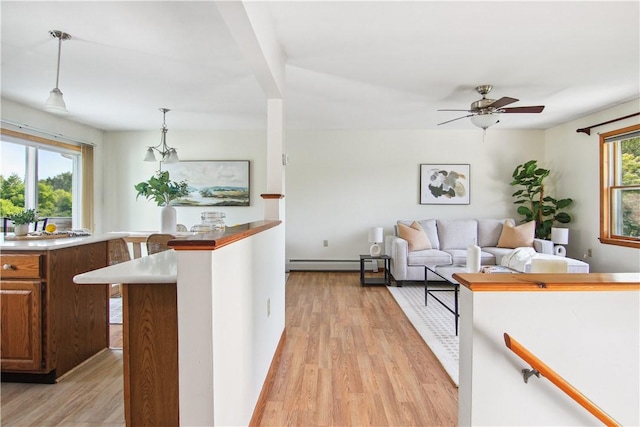 9 Jacob Dr, Erwin, NY 14870 - kitchen with light wood finished floors, pendant lighting, a ceiling fan, and a baseboard heating unit