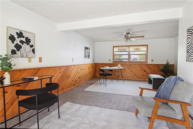 9 Jacob Dr, Erwin, NY 14870 - carpeted dining space featuring wainscoting, wood walls, a ceiling fan, and beamed ceiling