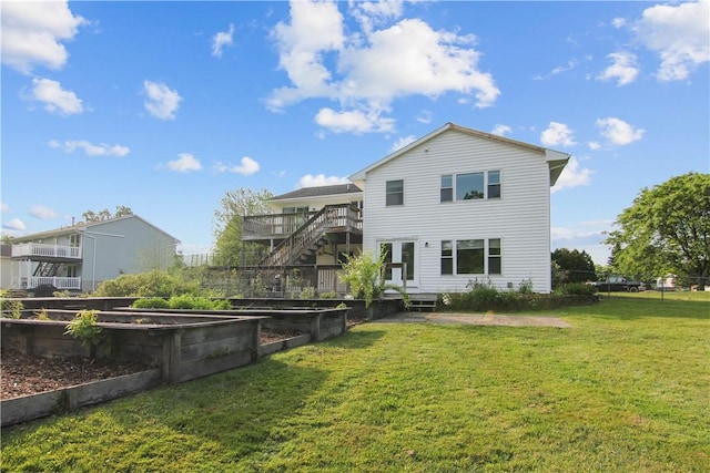 9 Jacob Dr, Erwin, NY 14870 - back of property with a garden, stairway, and a wooden deck