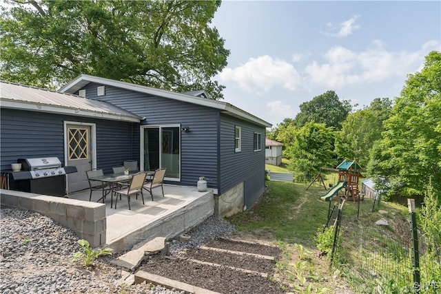 10256 State Route 26, Denmark, NY 13367 - back of house featuring a patio, a playground, and a metal roof