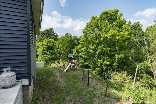 10256 State Route 26, Denmark, NY 13367 - view of grassy yard featuring a playground and a view of trees