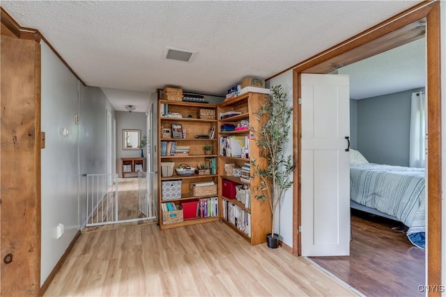 10256 State Route 26, Denmark, NY 13367 - sitting room with wood finished floors and a textured ceiling
