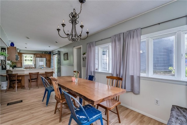 10256 State Route 26, Denmark, NY 13367 - dining room featuring light wood-style flooring and a chandelier