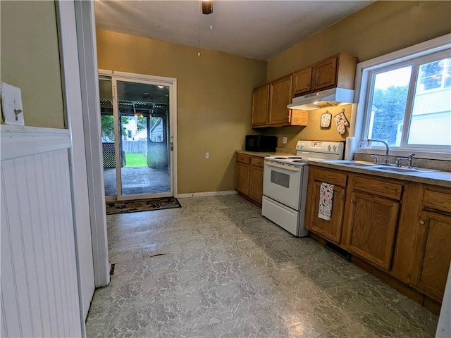 354 Euclid Ave, Elmira City, NY 14905 - kitchen featuring electric range, under cabinet range hood, brown cabinetry, and black microwave