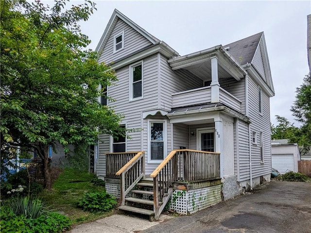 354 Euclid Ave, Elmira City, NY 14905 - view of front of property with a balcony, an outdoor structure, and a detached garage