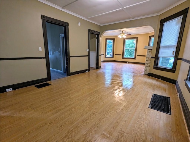 354 Euclid Ave, Elmira City, NY 14905 - empty room with arched walkways, light wood-style flooring, crown molding, and a ceiling fan