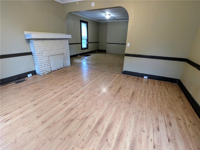 354 Euclid Ave, Elmira City, NY 14905 - empty room featuring arched walkways, wood finished floors, and crown molding