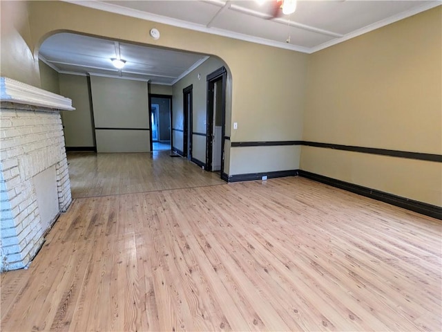 354 Euclid Ave, Elmira City, NY 14905 - spare room featuring wood finished floors, arched walkways, a ceiling fan, and ornamental molding