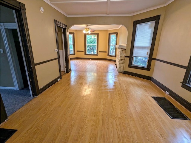 354 Euclid Ave, Elmira City, NY 14905 - spare room featuring arched walkways, light wood finished floors, ornamental molding, and a smoke detector