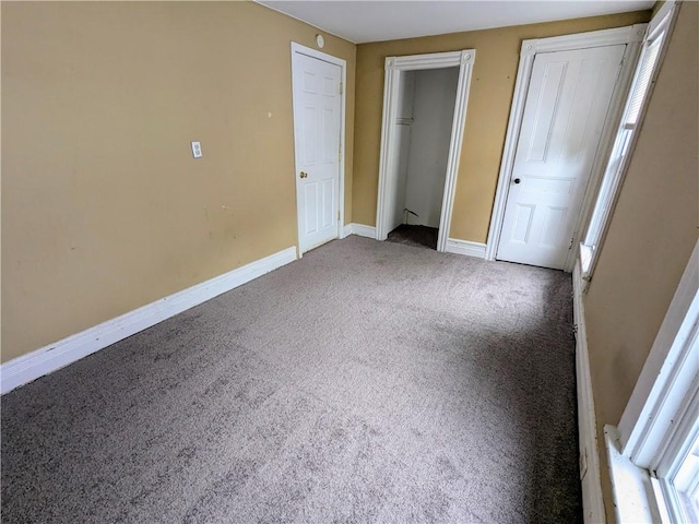 354 Euclid Ave, Elmira City, NY 14905 - unfurnished bedroom with carpet flooring and multiple closets