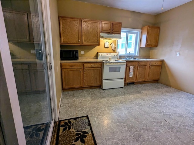 354 Euclid Ave, Elmira City, NY 14905 - kitchen with electric stove, under cabinet range hood, black microwave, and brown cabinets