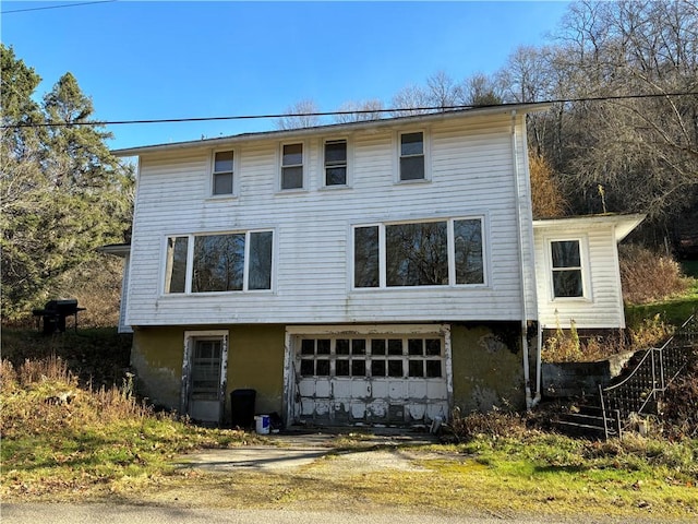 100 Brickwork Rd, Hamlin, PA 16735 - rear view of property with an attached garage and driveway