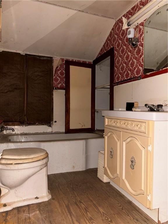 100 Brickwork Rd, Hamlin, PA 16735 - bathroom with vanity, vaulted ceiling, and wood finished floors