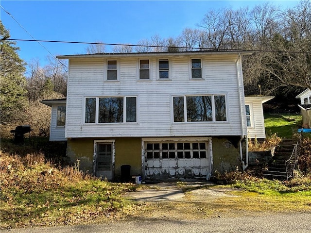 100 Brickwork Rd, Hamlin, PA 16735 - view of front facade with driveway, a garage, and stairway