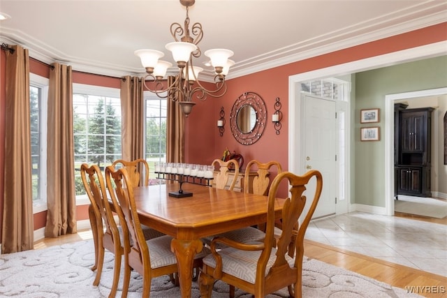 2371 Bullis Rd, Elma, NY 14059 - dining area with a chandelier, ornamental molding, and light wood-style floors