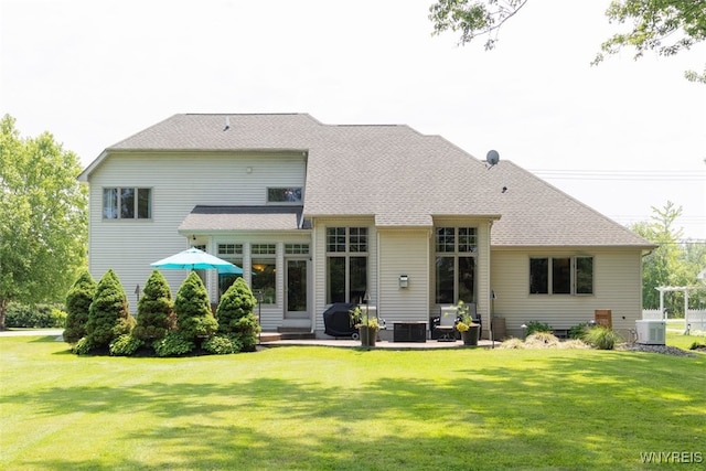 2371 Bullis Rd, Elma, NY 14059 - rear view of house with a lawn and a patio area