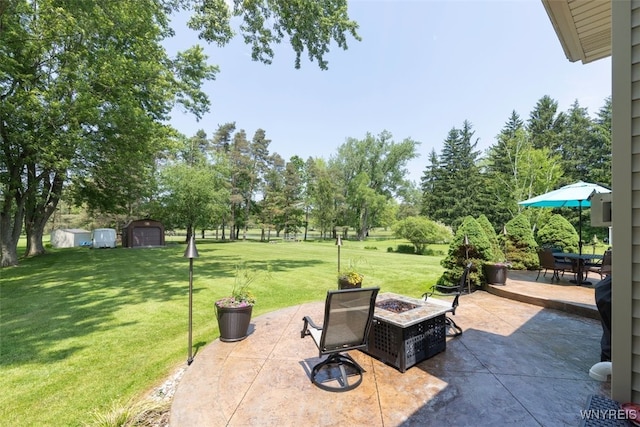 2371 Bullis Rd, Elma, NY 14059 - view of patio / terrace featuring an outdoor fire pit, an outbuilding, and outdoor dining area