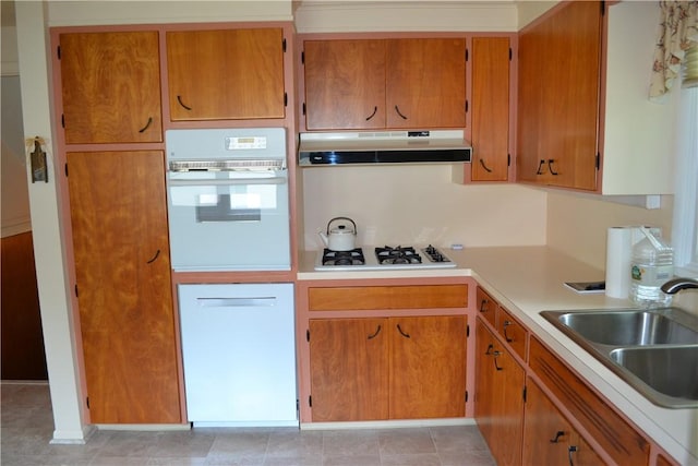 229 Everclay Dr, Greece, NY 14616 - kitchen with white appliances, under cabinet range hood, light countertops, and brown cabinetry