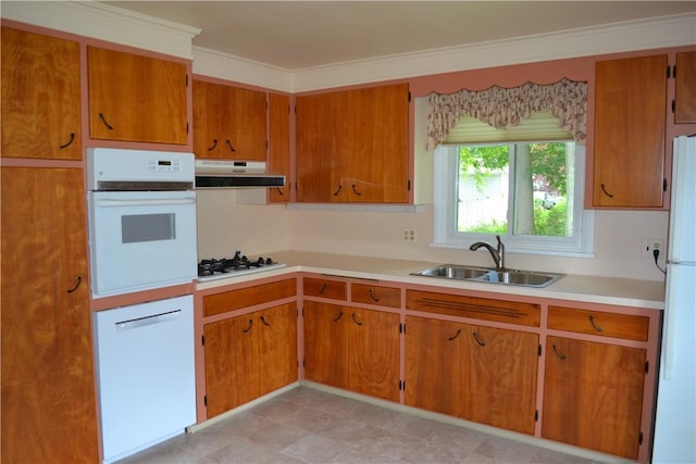 229 Everclay Dr, Greece, NY 14616 - kitchen with white appliances, under cabinet range hood, light countertops, brown cabinets, and ornamental molding