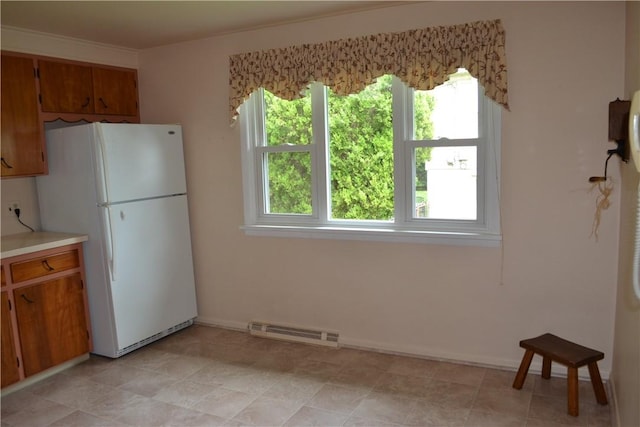 229 Everclay Dr, Greece, NY 14616 - kitchen featuring freestanding refrigerator, brown cabinets, and light countertops