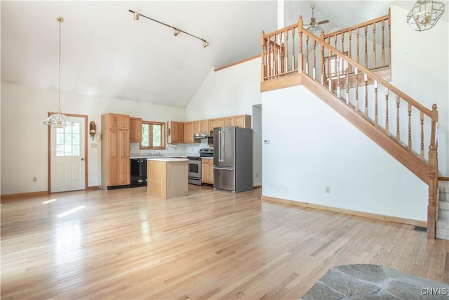 29591 Coon Bridge Rd, Theresa, NY 13691 - kitchen featuring appliances with stainless steel finishes, a chandelier, high vaulted ceiling, open floor plan, and track lighting