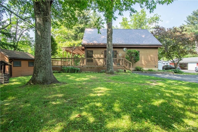 29591 Coon Bridge Rd, Theresa, NY 13691 - view of front of home with a deck, a front yard, and a metal roof