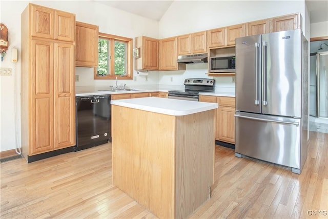 29591 Coon Bridge Rd, Theresa, NY 13691 - kitchen featuring appliances with stainless steel finishes, under cabinet range hood, light brown cabinetry, light wood-style flooring, and vaulted ceiling