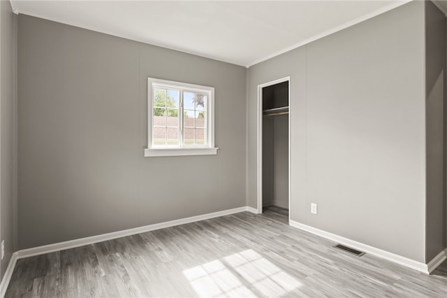 213 Auburn Ave, Gates, NY 14606 - unfurnished bedroom with wood finished floors and a closet