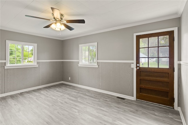 213 Auburn Ave, Gates, NY 14606 - unfurnished room featuring wood finished floors, a wainscoted wall, a ceiling fan, and crown molding