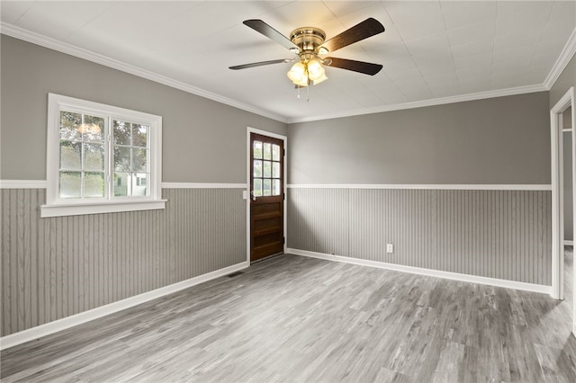 213 Auburn Ave, Gates, NY 14606 - spare room featuring wood finished floors, a wainscoted wall, ceiling fan, and ornamental molding