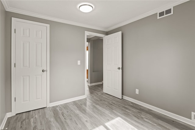 213 Auburn Ave, Gates, NY 14606 - unfurnished bedroom with wood finished floors and crown molding