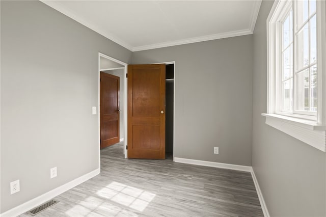 213 Auburn Ave, Gates, NY 14606 - empty room with wood finished floors, ornamental molding, and healthy amount of natural light