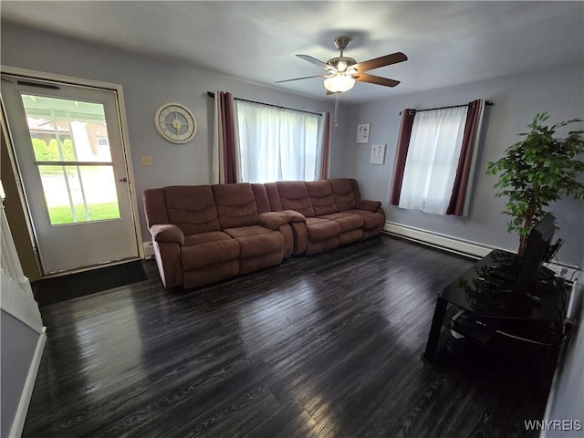 674 79th St, Niagara Falls, NY 14304 - living room featuring baseboard heating, wood finished floors, healthy amount of natural light, and ceiling fan