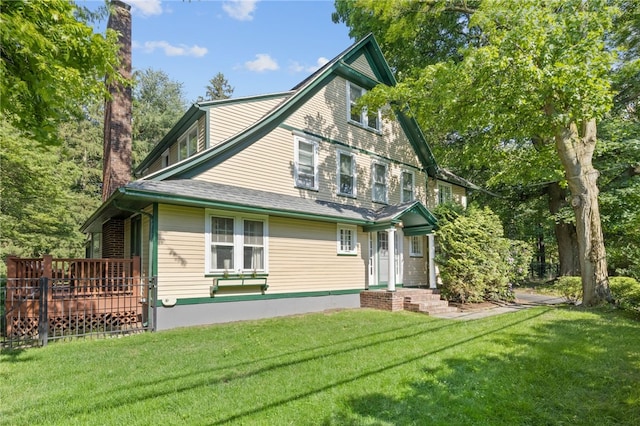 960 Landing Rd N, Brighton, NY 14625 - rear view of property with a yard, a chimney, and a deck
