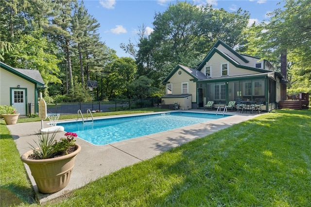 960 Landing Rd N, Brighton, NY 14625 - view of swimming pool with a patio, a sunroom, view of scattered trees, and a jacuzzi