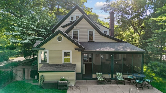 960 Landing Rd N, Brighton, NY 14625 - rear view of property with a shingled roof, a sunroom, and a patio area
