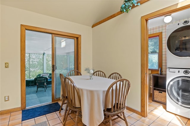 960 Landing Rd N, Brighton, NY 14625 - dining space with stacked washing machine and dryer and light tile patterned floors