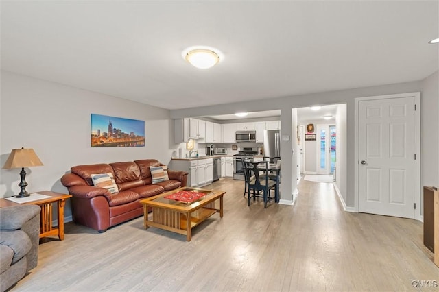101 Post Lamp Cir, Cicero, NY 13212 - living area with light wood-style flooring and baseboards
