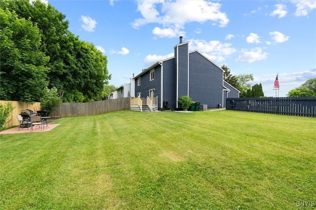 101 Post Lamp Cir, Cicero, NY 13212 - rear view of house with a fenced backyard, a chimney, and a patio