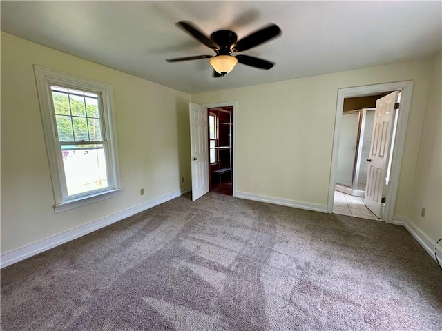 540 Derrick Rd, Foster-Town, PA 16701 - unfurnished bedroom with carpet, connected bathroom, and a ceiling fan
