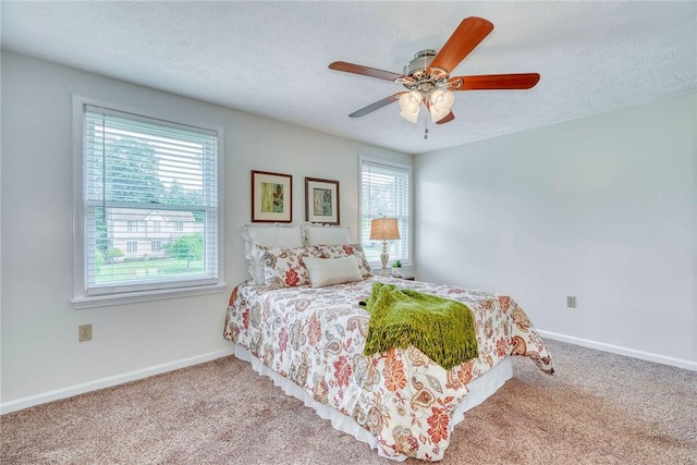 731 Brookeville Dr, Webster, NY 14580 - bedroom featuring multiple windows, a textured ceiling, carpet, and a ceiling fan