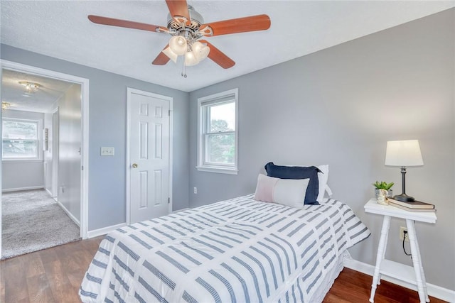 731 Brookeville Dr, Webster, NY 14580 - bedroom featuring multiple windows, wood finished floors, and a ceiling fan
