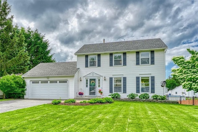 731 Brookeville Dr, Webster, NY 14580 - colonial-style house featuring a garage, driveway, and a shingled roof