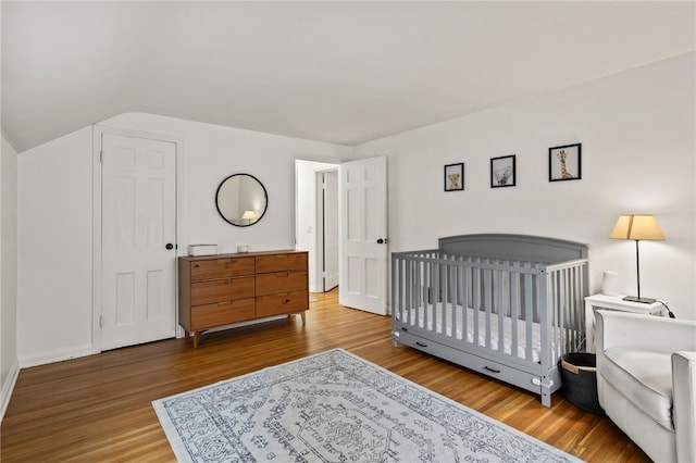 144 Montclair Dr, Irondequoit, NY 14617 - bedroom featuring wood finished floors and lofted ceiling